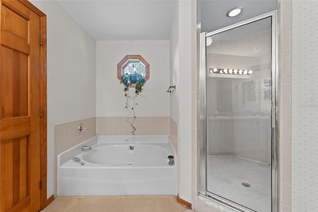 bathroom featuring shower with separate bathtub