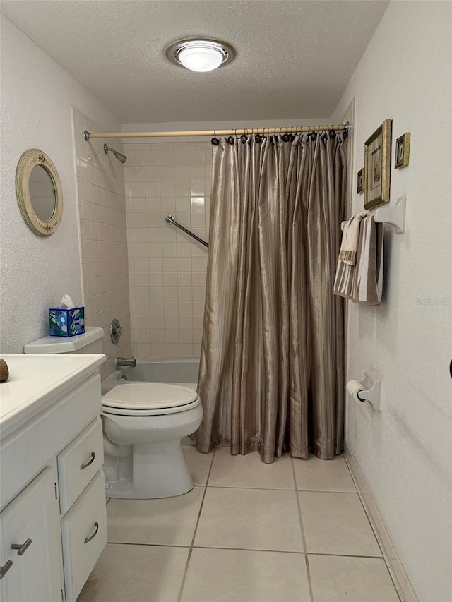 full bathroom with toilet, vanity, tile patterned flooring, shower / tub combo, and a textured ceiling