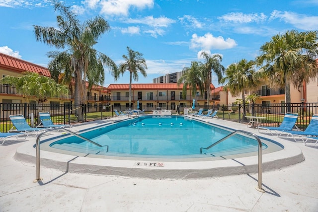 view of swimming pool with a patio area