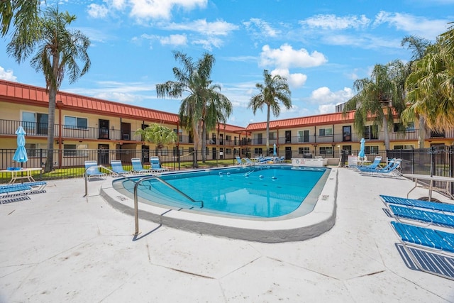 view of swimming pool featuring a patio