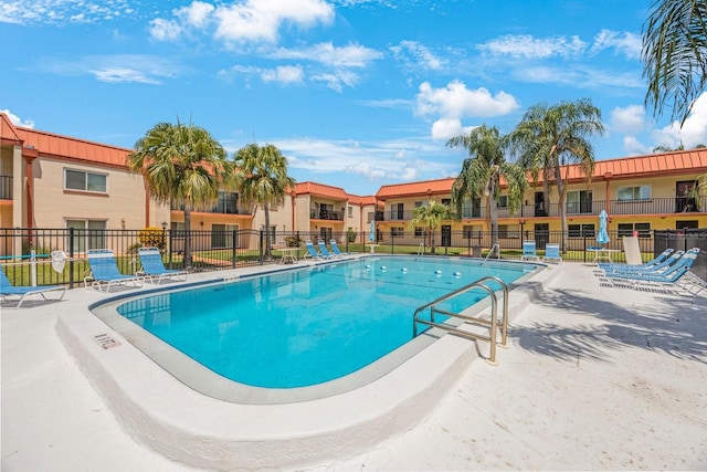 view of swimming pool with a patio