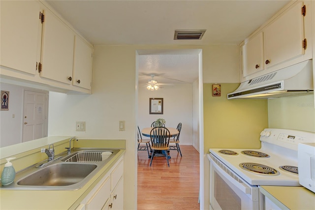 kitchen featuring ceiling fan, white cabinetry, light hardwood / wood-style flooring, sink, and white appliances