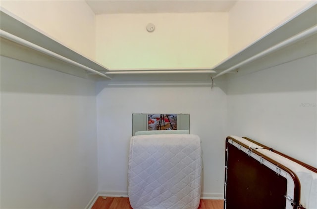 walk in closet featuring light hardwood / wood-style floors