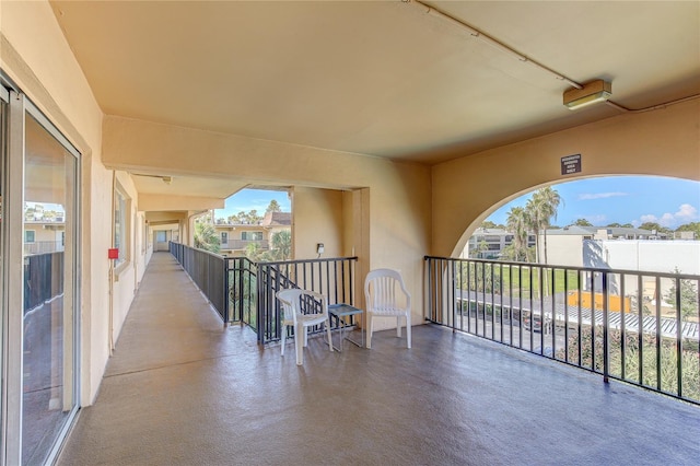 view of patio featuring a balcony