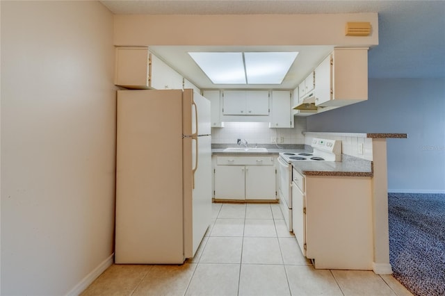 kitchen featuring white cabinets, white appliances, sink, light tile patterned flooring, and decorative backsplash