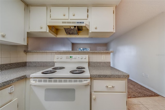 kitchen featuring light tile patterned floors, white electric stove, and tasteful backsplash