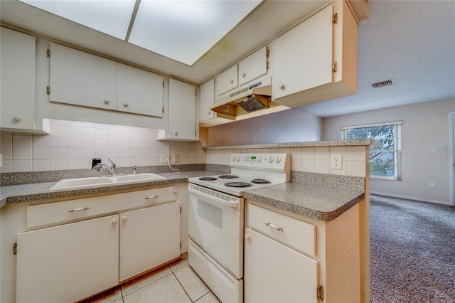 kitchen featuring backsplash, sink, light carpet, and white range with electric cooktop