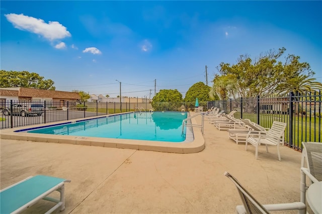 view of swimming pool featuring a patio