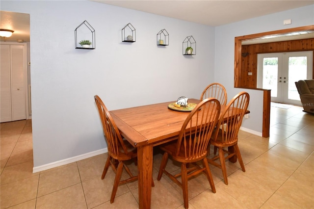 7519 Harbor View Way, Seminole, FL 33776 - dining room with light tile patterned floors, french doors, and baseboards