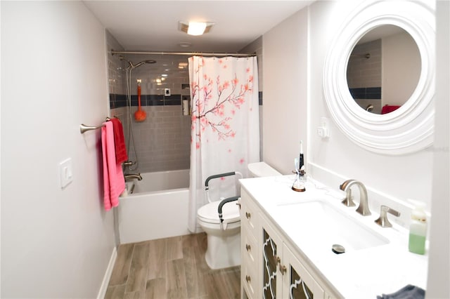 7519 Harbor View Way, Seminole, FL 33776 - full bathroom featuring vanity, toilet, wood finished floors, and shower / bath combo with shower curtain