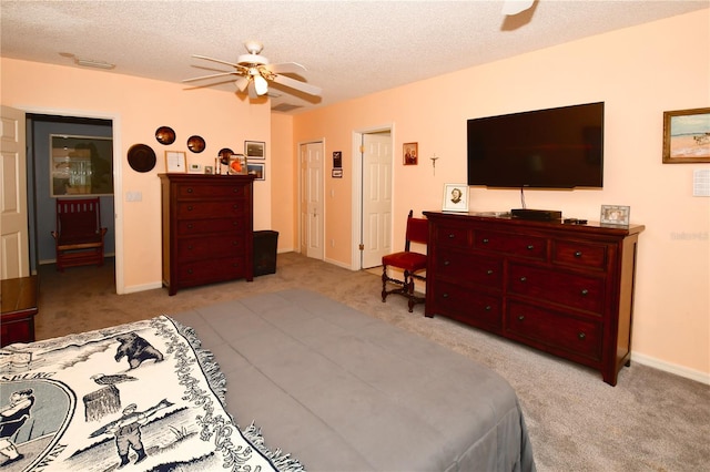 7519 Harbor View Way, Seminole, FL 33776 - carpeted bedroom featuring baseboards, a textured ceiling, and a ceiling fan