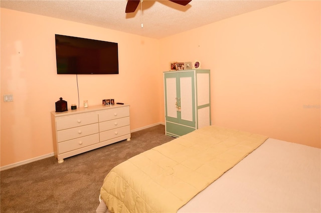 7519 Harbor View Way, Seminole, FL 33776 - bedroom with a ceiling fan, baseboards, carpet floors, and a textured ceiling