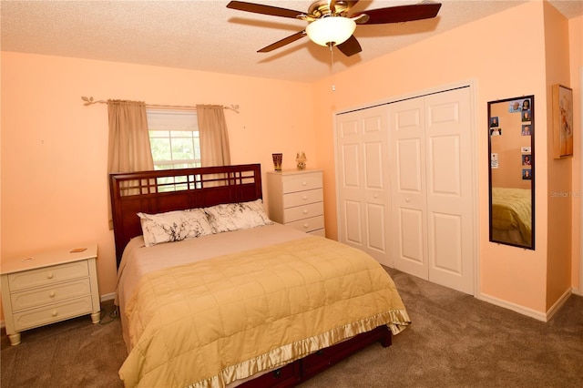 7519 Harbor View Way, Seminole, FL 33776 - bedroom with baseboards, ceiling fan, carpet, a closet, and a textured ceiling