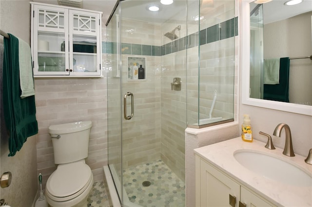 7519 Harbor View Way, Seminole, FL 33776 - bathroom with vanity, toilet, recessed lighting, and a stall shower