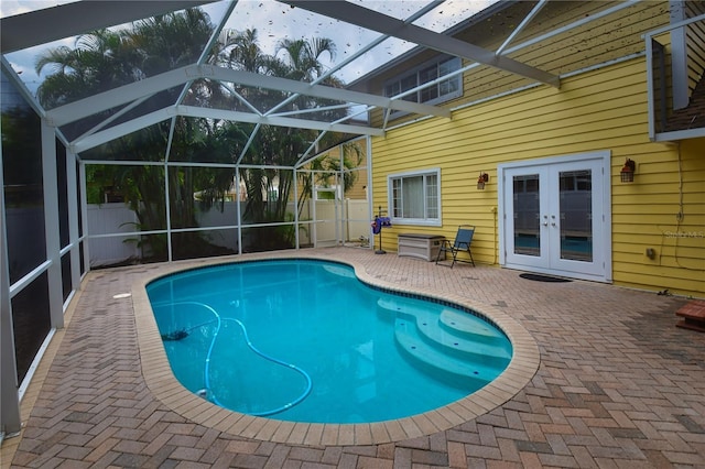 7519 Harbor View Way, Seminole, FL 33776 - view of swimming pool featuring a fenced in pool, fence, french doors, a lanai, and a patio area