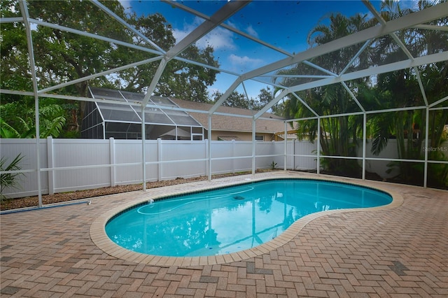 7519 Harbor View Way, Seminole, FL 33776 - view of swimming pool with a patio area, a lanai, and a fenced backyard