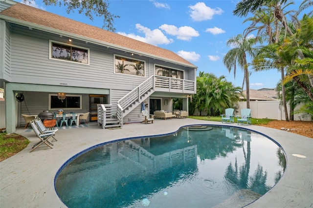 view of pool with outdoor lounge area and a patio