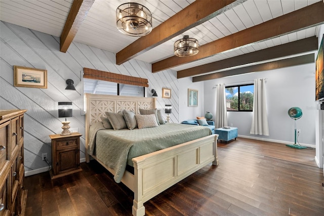 bedroom with beam ceiling, wood walls, dark hardwood / wood-style flooring, and an inviting chandelier