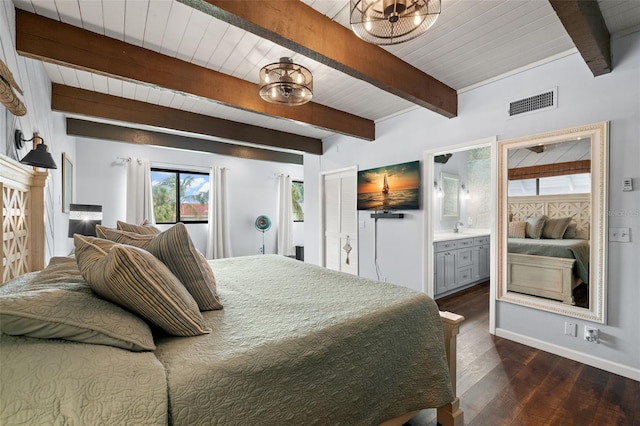 bedroom featuring beam ceiling, connected bathroom, sink, dark hardwood / wood-style floors, and a notable chandelier