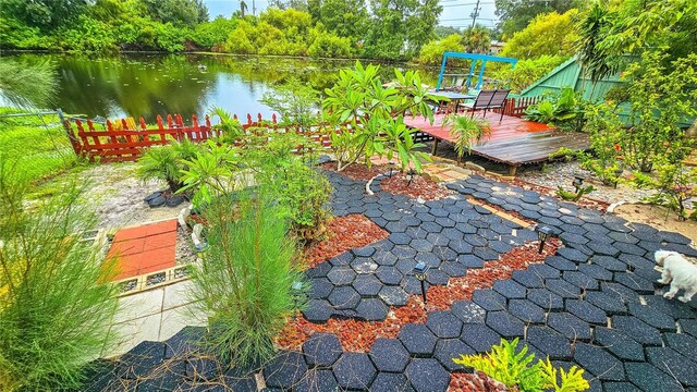 view of yard featuring a deck with water view