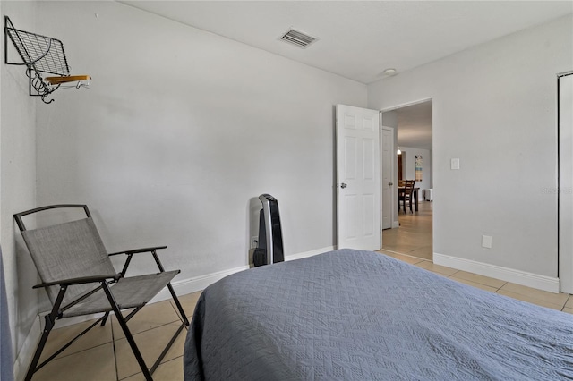 bedroom featuring light tile patterned floors