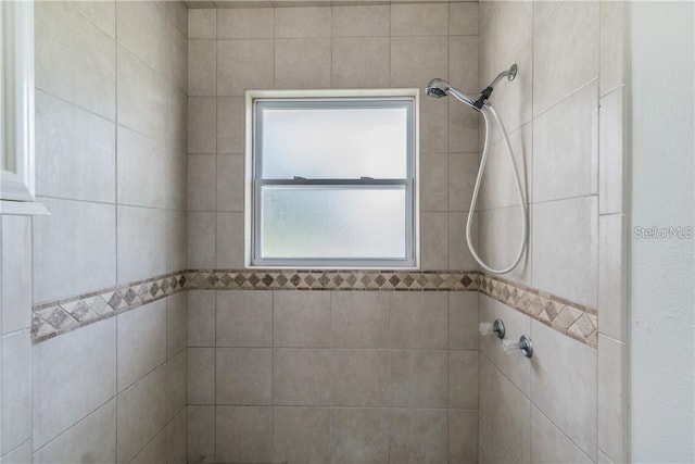 bathroom with a tile shower