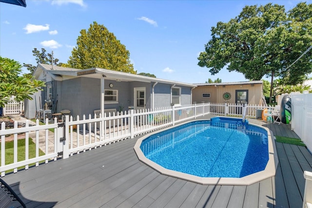 view of swimming pool featuring a wooden deck