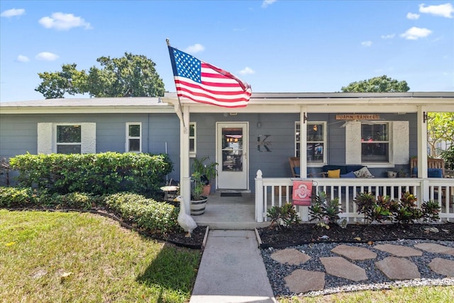 single story home with a porch