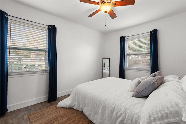 bedroom with ceiling fan and wood-type flooring