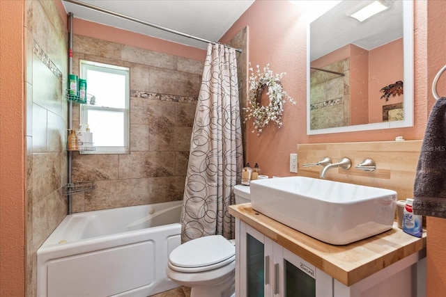 full bathroom featuring sink, shower / bath combo, and toilet