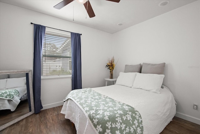 bedroom featuring ceiling fan and dark hardwood / wood-style floors