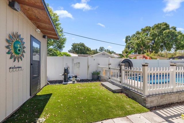 view of yard with a pool side deck