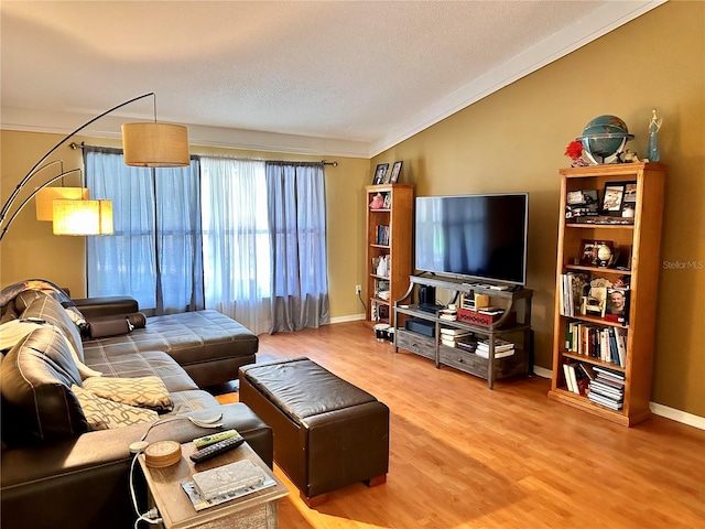 living room with hardwood / wood-style flooring and crown molding