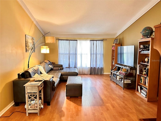 living room with hardwood / wood-style floors and ornamental molding