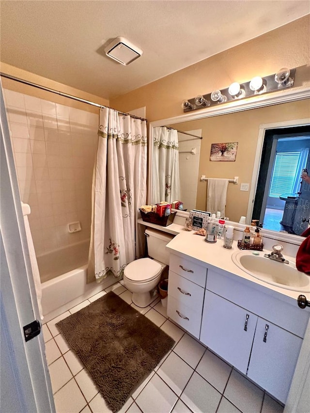 full bathroom featuring tile patterned flooring, vanity, toilet, and shower / bathtub combination with curtain