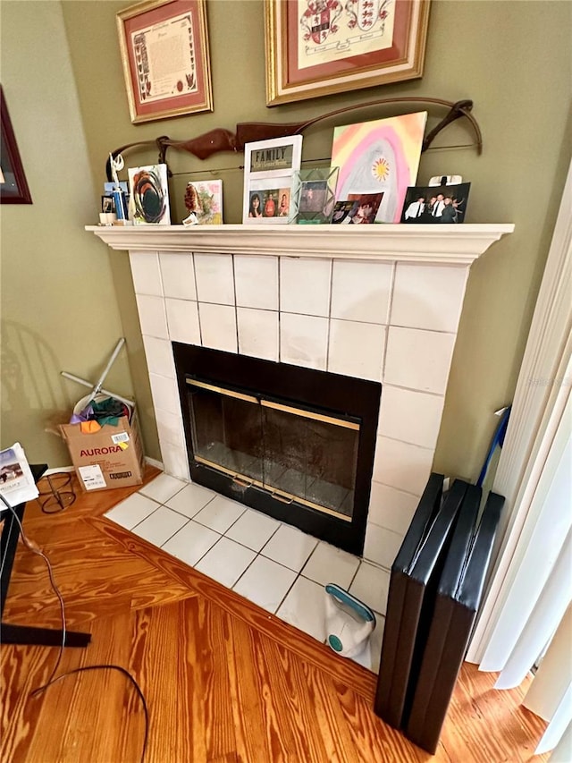 room details featuring a tile fireplace