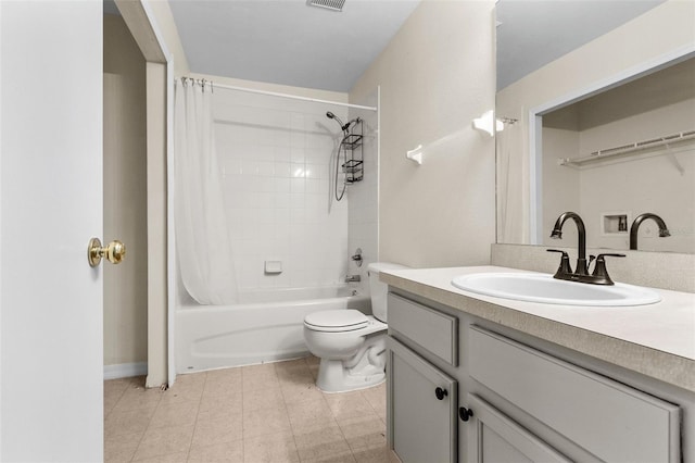 full bathroom with vanity, shower / tub combo, and toilet