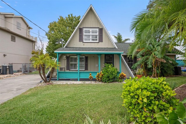 view of front of house featuring a front yard and covered porch