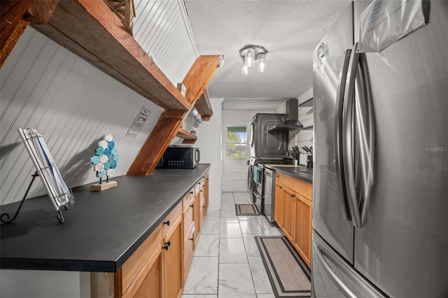 kitchen with appliances with stainless steel finishes and exhaust hood