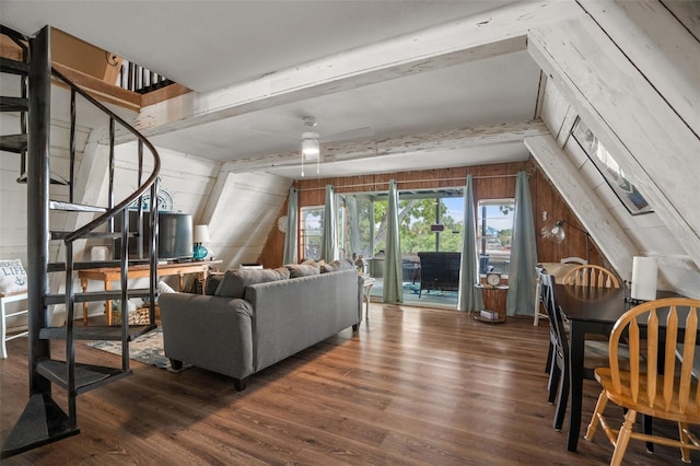 living room featuring wooden walls, dark hardwood / wood-style flooring, vaulted ceiling with beams, and ceiling fan