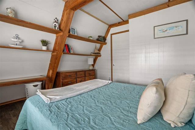 bedroom with dark wood-type flooring