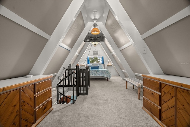 bedroom featuring lofted ceiling and carpet flooring