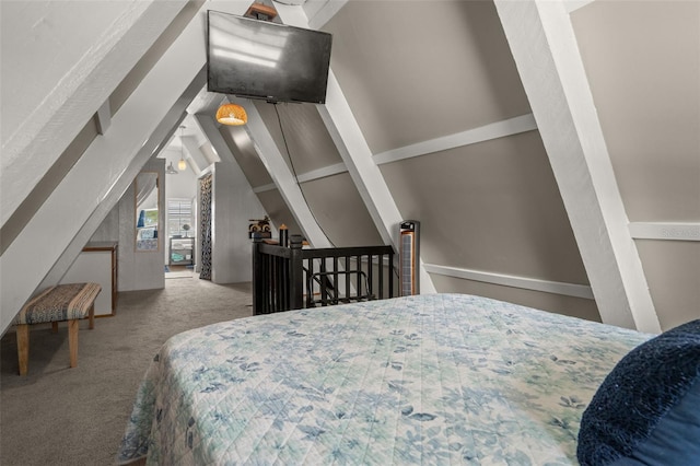 carpeted bedroom featuring vaulted ceiling