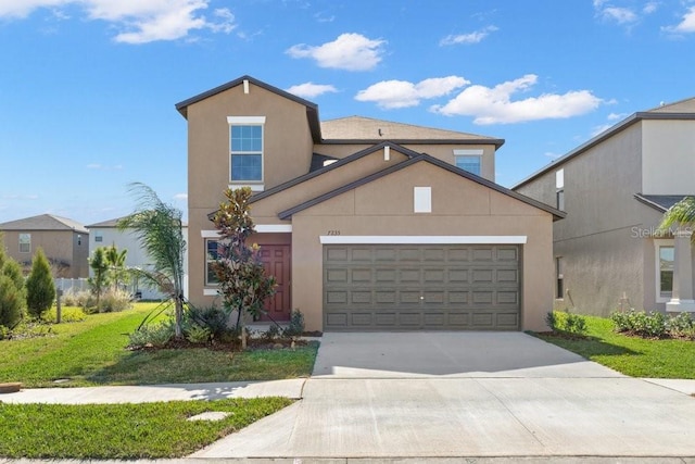 view of front property with a garage and a front yard