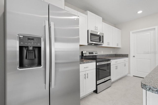 kitchen with white cabinets and stainless steel appliances