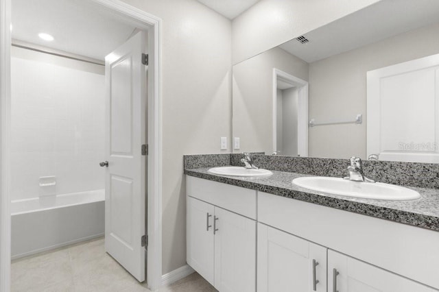 bathroom with vanity, washtub / shower combination, and tile patterned flooring