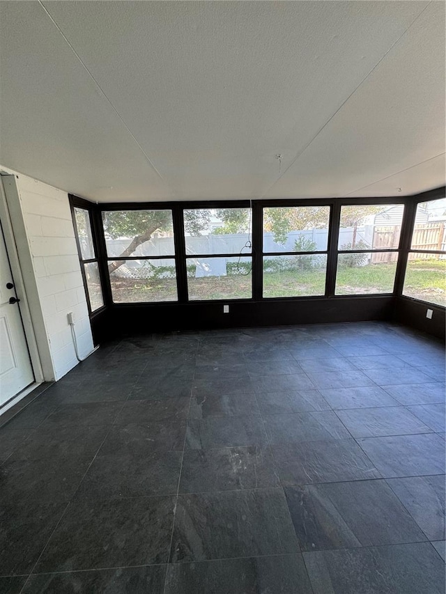 unfurnished sunroom featuring plenty of natural light