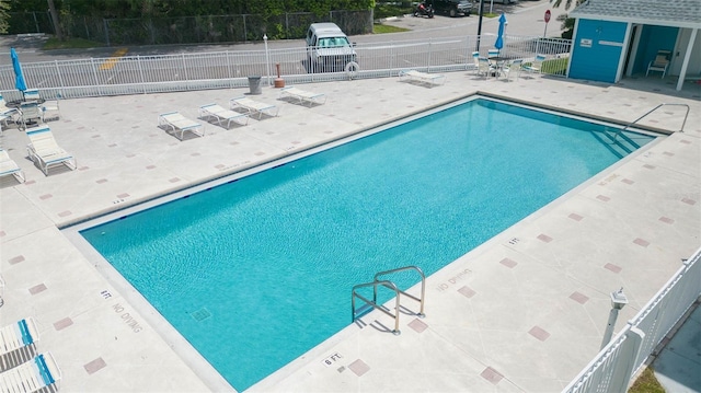 view of swimming pool with a patio