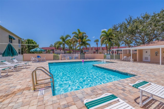 view of swimming pool with a patio