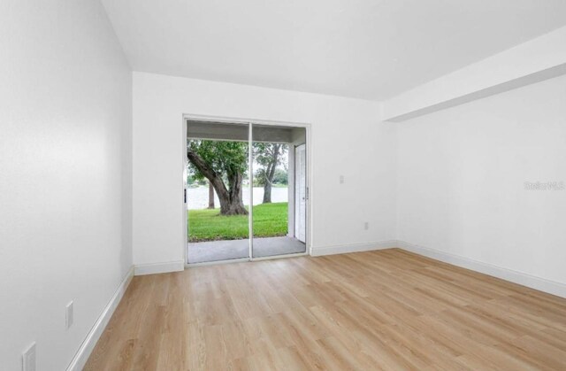 spare room with light wood-type flooring